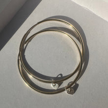 Load image into Gallery viewer, gold filled 40mm endless hoops with sterling silver baby heart pendants
