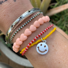 Load image into Gallery viewer, yellow seed bead bracelet with a fun sterling silver smiley face charm 
