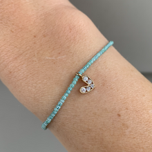 Load image into Gallery viewer, green and white striped seed bead bracelet with a gold plated heart charm with clear cz crystal stones