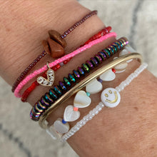 Load image into Gallery viewer, neon pink seed bead stretchy bracelet with a gold plated heart charm with clear cz crystal stones