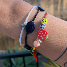 Load image into Gallery viewer, red, orange and turquoise seed bead bracelet with a peach heart, round strawberry, skull, smiley and a glass chili pepper and sterling silver star bracelet
