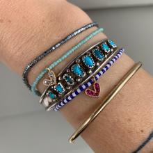 Load image into Gallery viewer, green and white striped seed bead stretchy bracelet with a gold plated heart charm with clear cz crystal stones