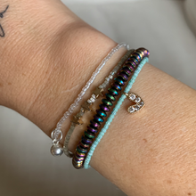Load image into Gallery viewer, green and white striped seed bead bracelet with a gold plated heart charm with clear cz crystal stones