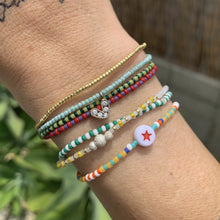 Load image into Gallery viewer, green and white striped seed bead bracelet with a gold plated heart charm with clear cz crystal stones