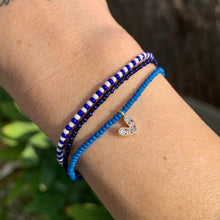 Load image into Gallery viewer, blue seed bead bracelet with a gold plated heart charm with clear cz crystal stones
