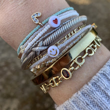 Load image into Gallery viewer, multi colored seed bead bracelet with a gold plated heart charm with clear cz crystal stones