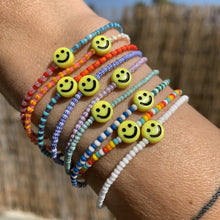 Load image into Gallery viewer, multi colored striped colorful seed bead stretchy bracelets with yellow smiley face beads
