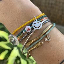 Load image into Gallery viewer, green and white striped seed bead bracelet with a gold plated heart charm with clear cz crystal stones