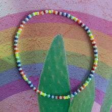 Load image into Gallery viewer, pearly and rainbow colored beaded elastic bracelet, red, orange, yellow, green, blue, purple
