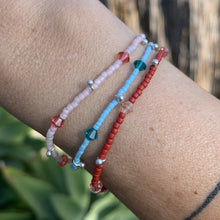 Load image into Gallery viewer, blue, red and pink seed bead, Swarovski crystal and sterling silver charm bracelet