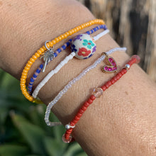 Load image into Gallery viewer, blue, red and pink seed bead, Swarovski crystal and sterling silver charm bracelet