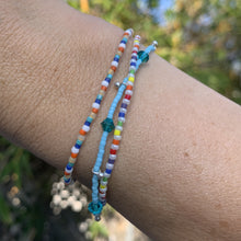 Load image into Gallery viewer, blue, red and pink seed bead, Swarovski crystal and sterling silver charm bracelet