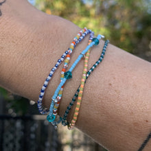 Load image into Gallery viewer, blue, red and pink seed bead, Swarovski crystal and sterling silver charm bracelet