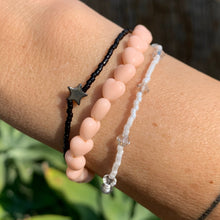Load image into Gallery viewer, light peach heart bead stretchy bracelet and black star bracelet and white Swarovski crystal bracelet
