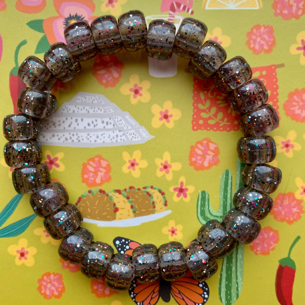 dark grey plastic pony bead stretchy bracelet with rainbow glitter