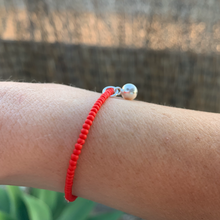 Load image into Gallery viewer, red seed bead bracelet with a sterling silver jingle bell charm
