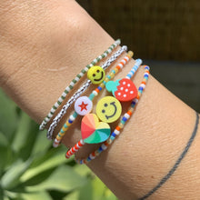 Load image into Gallery viewer, blue, white and red patterned seed bead bracelet with a strawberry, smiley face and multi colored heart bead
