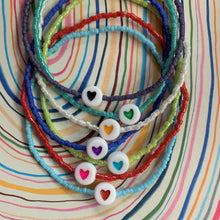 Load image into Gallery viewer, multi colored seed bead stretchy bracelet with a heart bead

