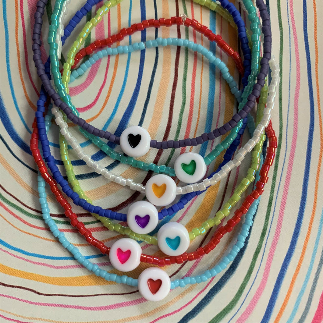 multi colored seed bead stretchy bracelet with a heart bead