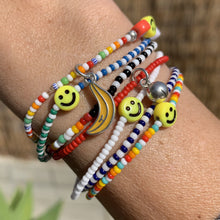 Load image into Gallery viewer, multi colored, patterned seed bead bracelets with a yellow smiley face bead
