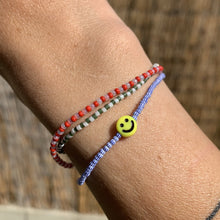 Load image into Gallery viewer, blue and white striped seed bead bracelet with a yellow smiley face bead
