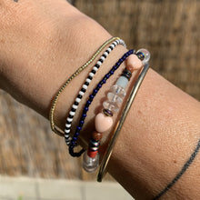 Load image into Gallery viewer, shiny black and navy seed bead stretch bracelet and gold bracelets
