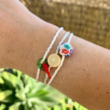 Load image into Gallery viewer, white seed bead stretch bracelet with a glass chili pepper and lemon and flower bead bracelets
