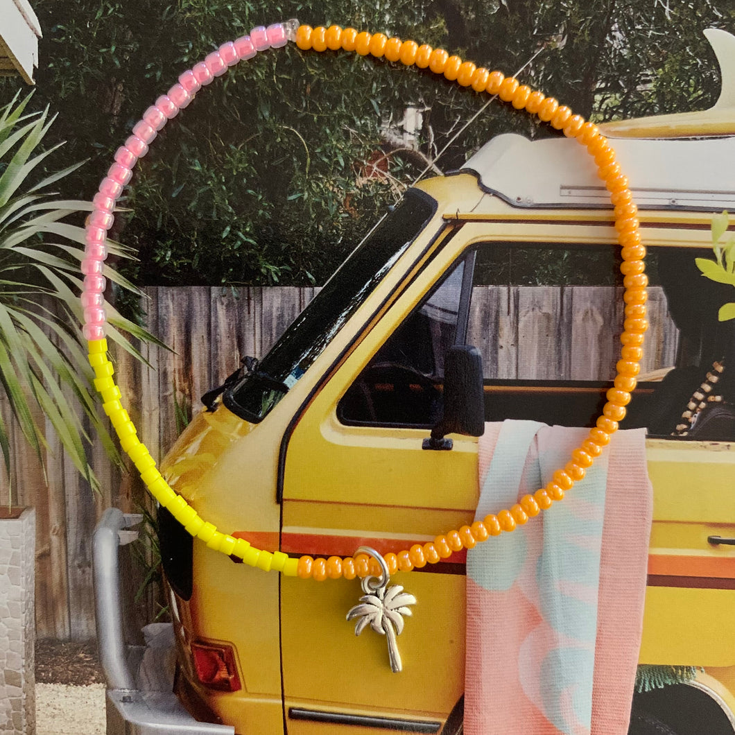 orange, pink and yellow seed bead bracelet with a sterling silver palm tree charm