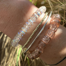 Load image into Gallery viewer, champagne colored glitter plastic pony bead stretchy bracelet

