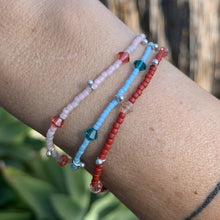 Load image into Gallery viewer, blue, red and pink seed bead, Swarovski crystal and sterling silver charm bracelet
