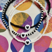 Load image into Gallery viewer, black and white seed bead bracelet with black heart bead

