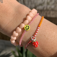 Load image into Gallery viewer, light peach heart bead stretchy bracelet and yellow smiley face bracelet and enamel strawberry bracelet
