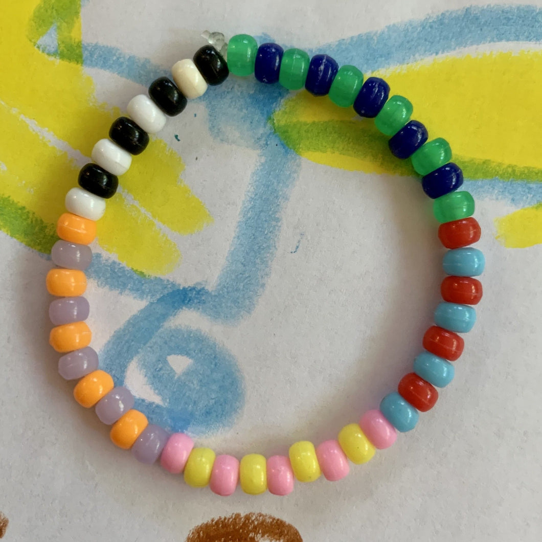 multi colored, patterned plastic mini pony bead stretchy braceletmulti colored, patterned plastic mini pony bead stretchy bracelet