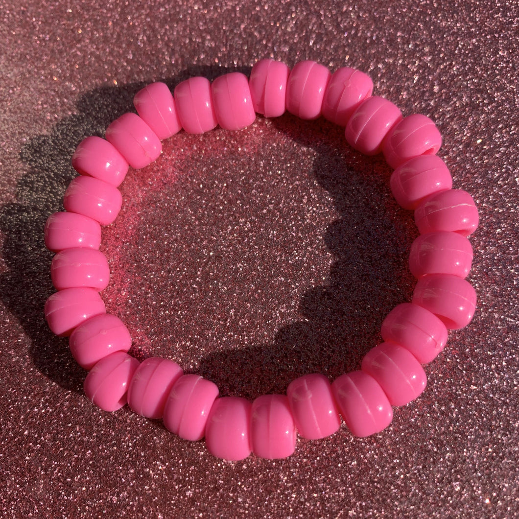 pink plastic pony bead stretch bracelet