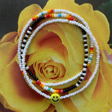 Load image into Gallery viewer, white black red orange yellow green blue smiley face seed bead bracelet set
